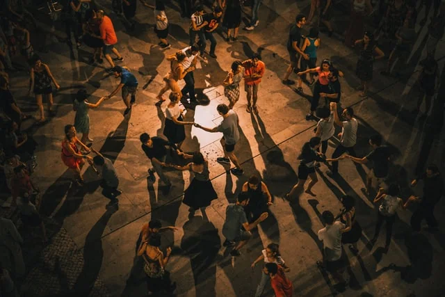 Adults dancing salsa at a weekly class in Bournemouth